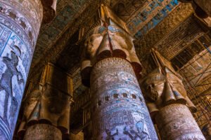 Hathor-headed columns inside the hypostyle hall at Dendera Temple