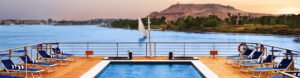 Luxury Nile cruise sundeck with swimming pool and river view