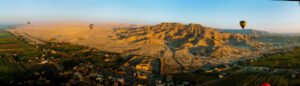 Hot air balloons flying over Luxor west bank near Valley of the Kings