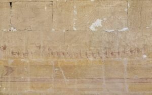 Ancient Egyptian wall reliefs and hieroglyphs inside Hatshepsut Temple